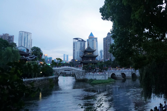 Jiaxiu Tower illuminated at night in Guiyang