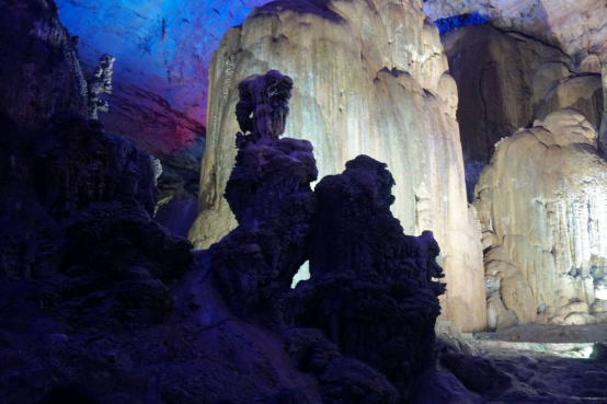 Underground limestone formations illuminated inside Zhijin Cave