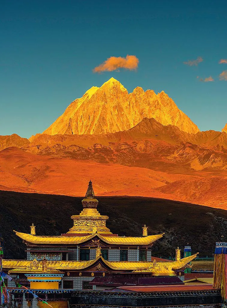 Golden sunrise over Yala Snow Mountain at Tagong Grassland